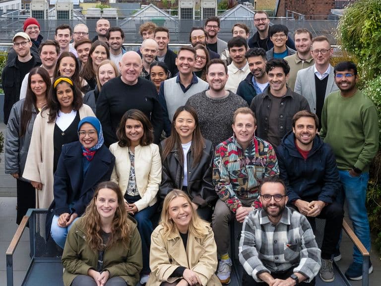 The Popsa team pose on the roof of their Soho office